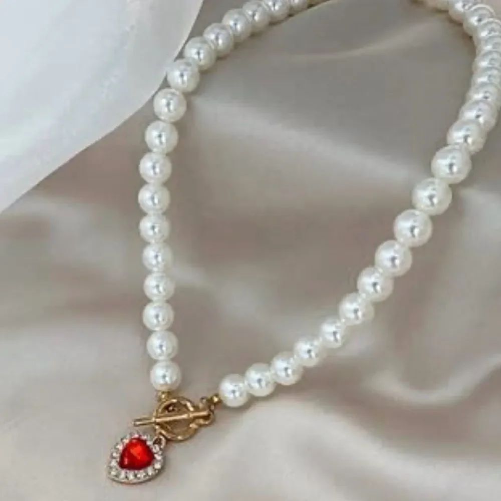 Lustrous Pearl Necklace with Red Heart Charm